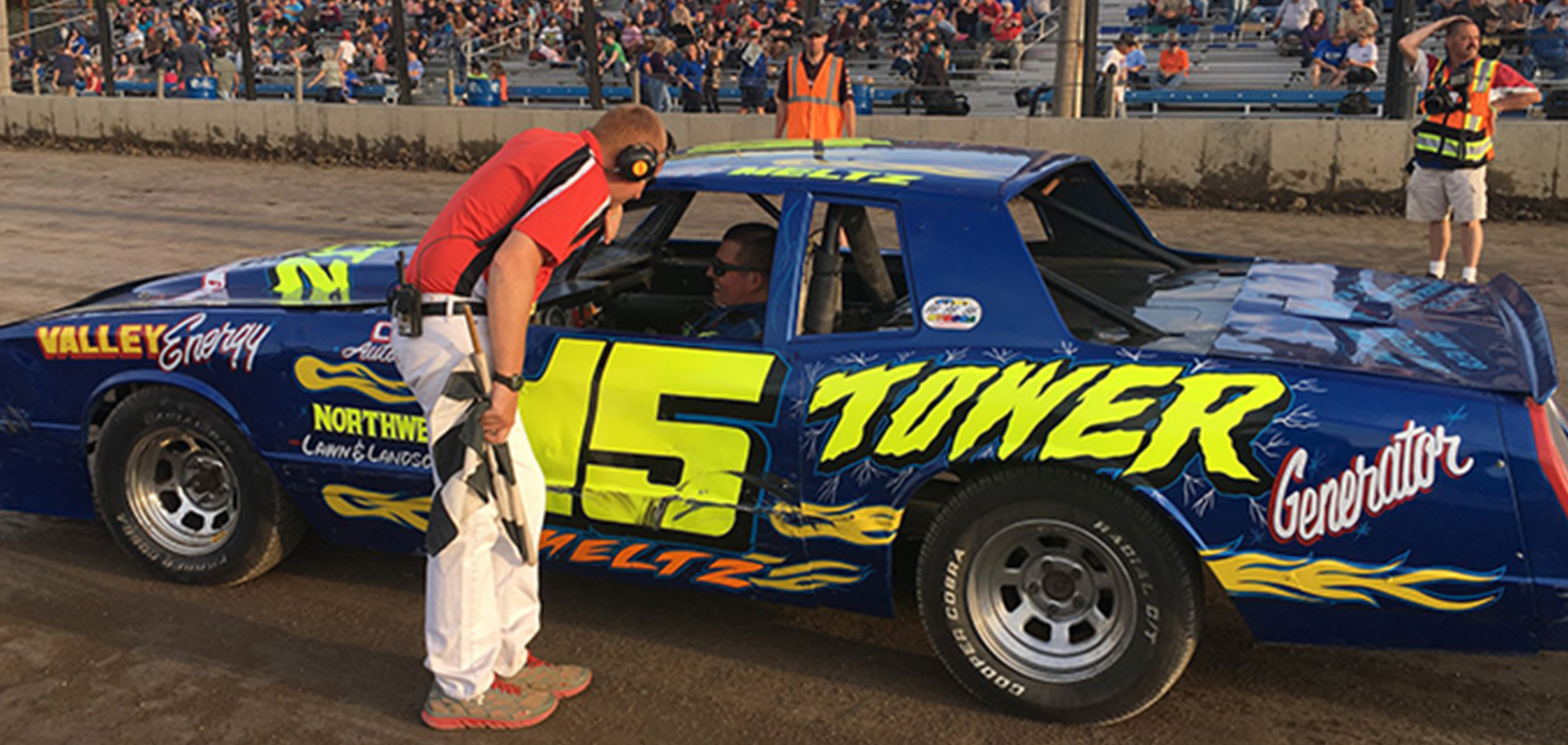 Image of Jeff Meltz Jr. in his racing car sponsored by Tower Generator.