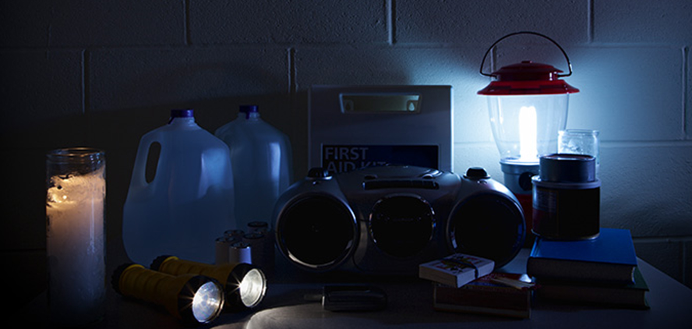 A countertop covered with miscellaneous items used in a power outage.