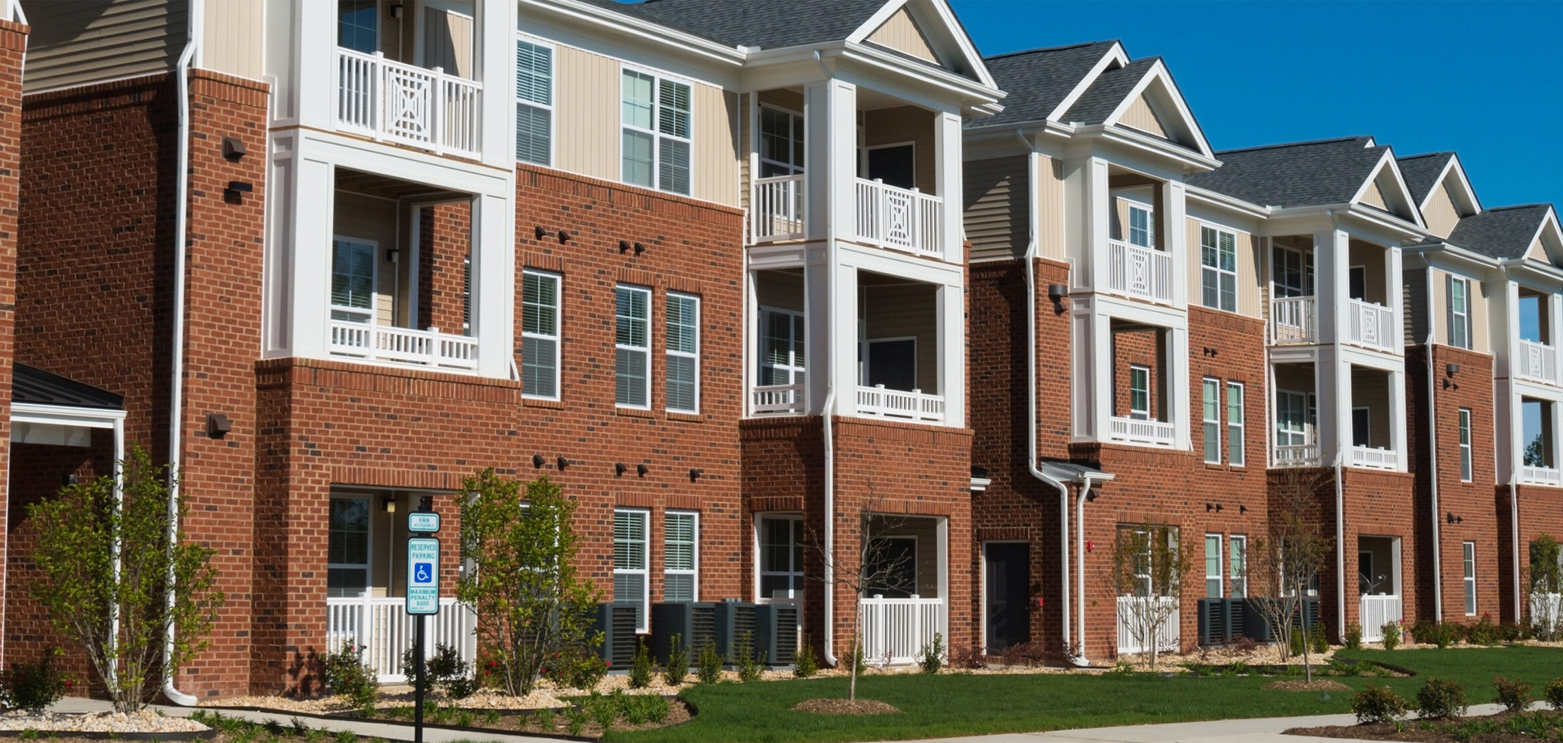 Three-story condominium complex.