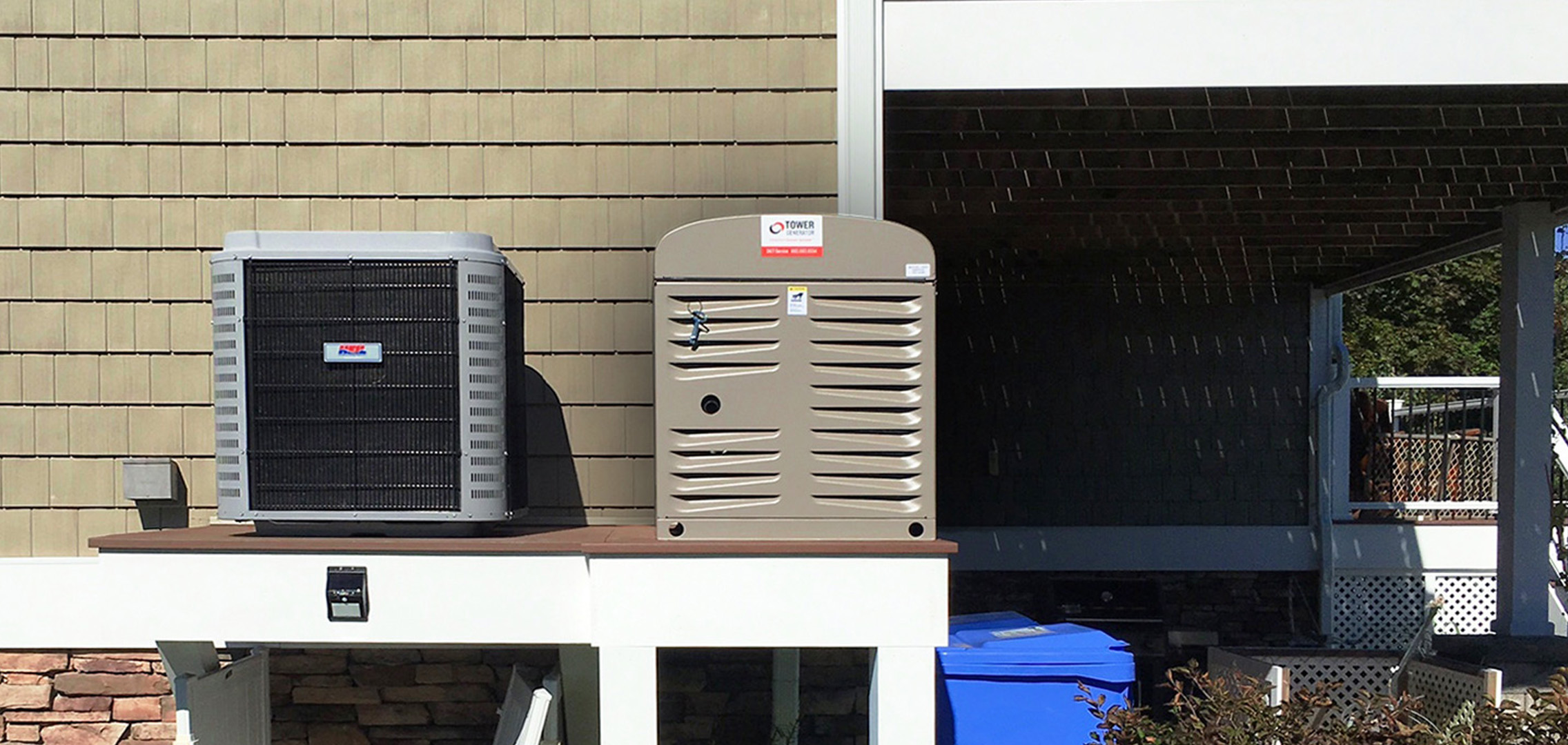 Residential generator next to a central AC unit