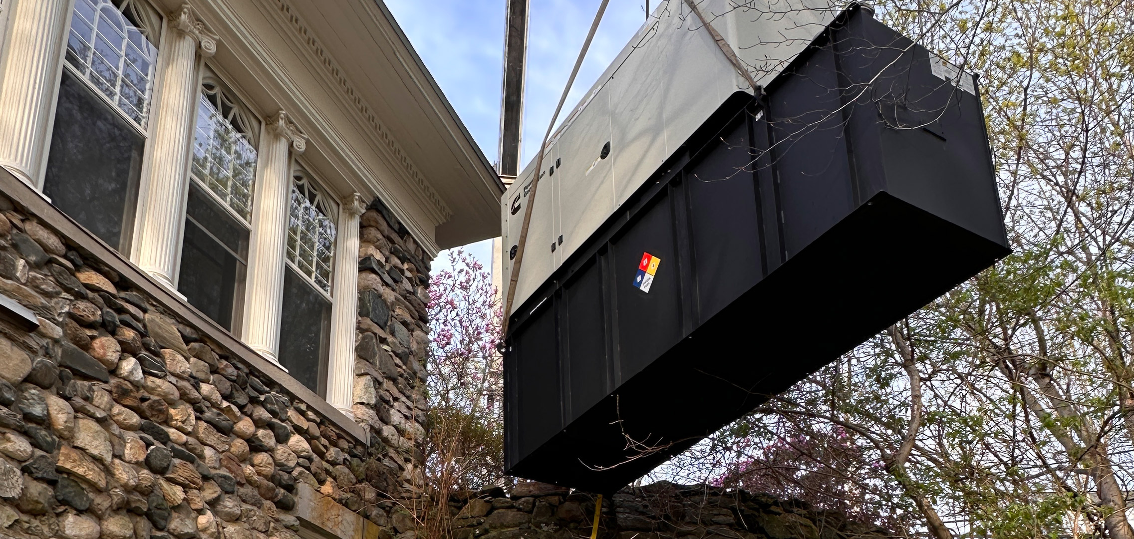 Generator on lift outside being moved