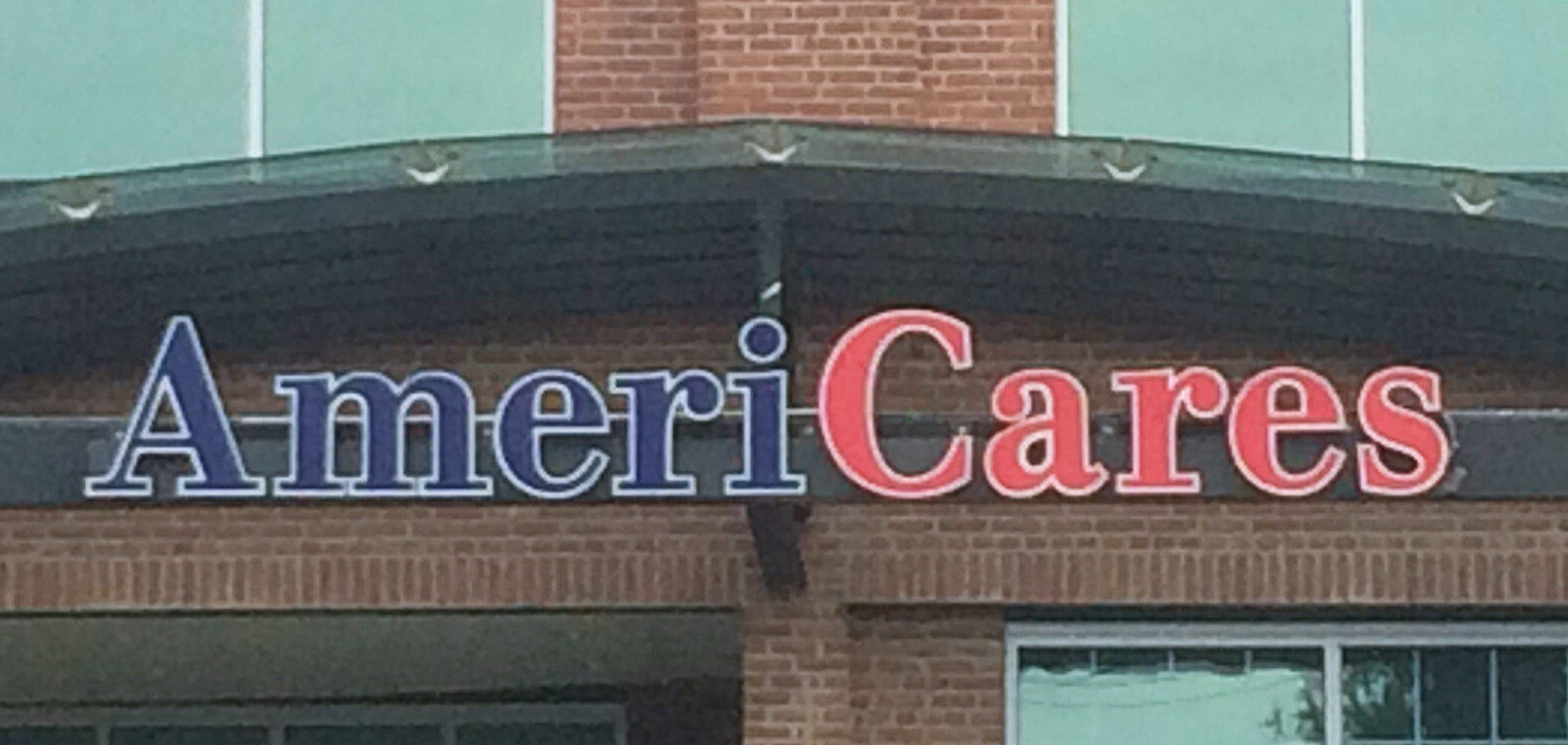 AmeriCares blue and red building sign